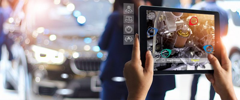 Tablet analyzing a car engine